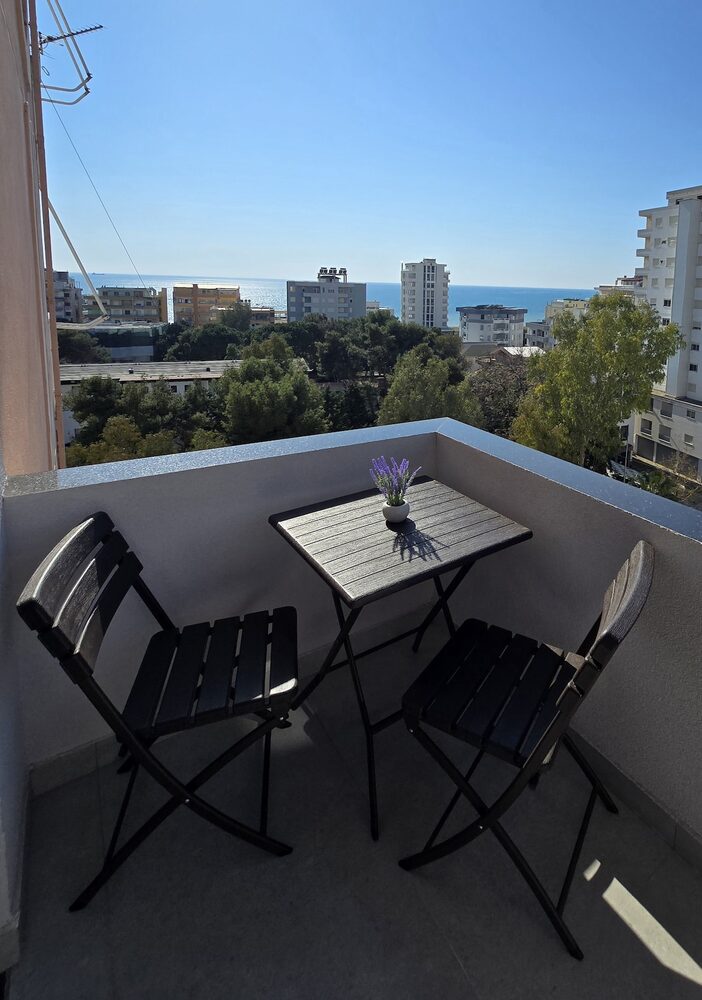 View over Durrës rooftops toward the sea from the balcony