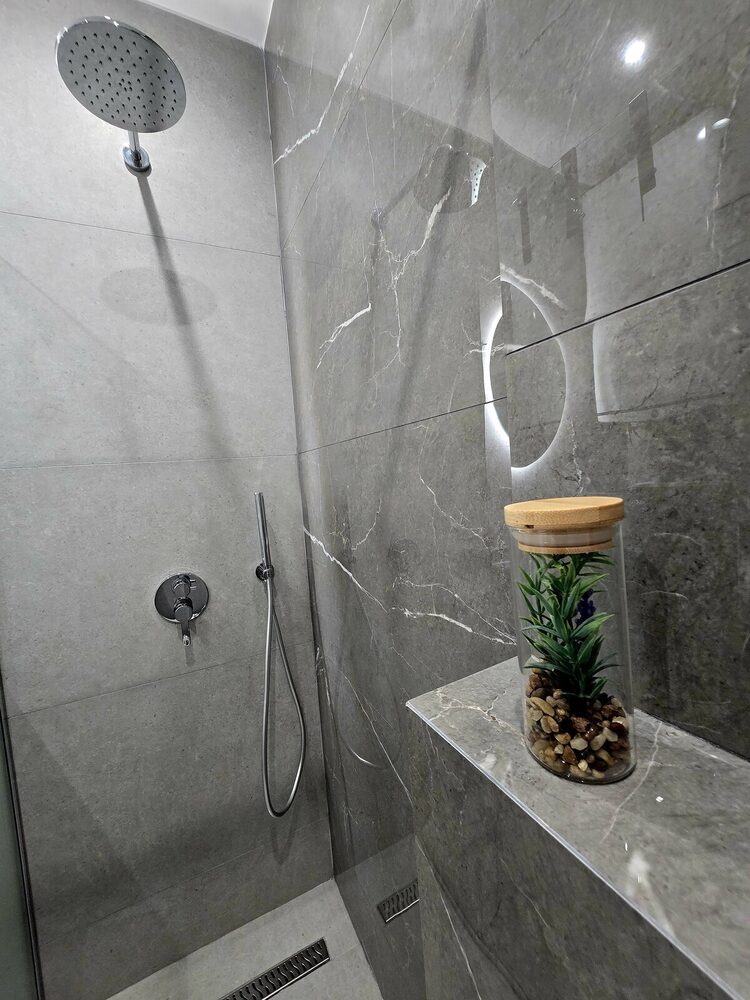 Rainfall shower with stone-look tile