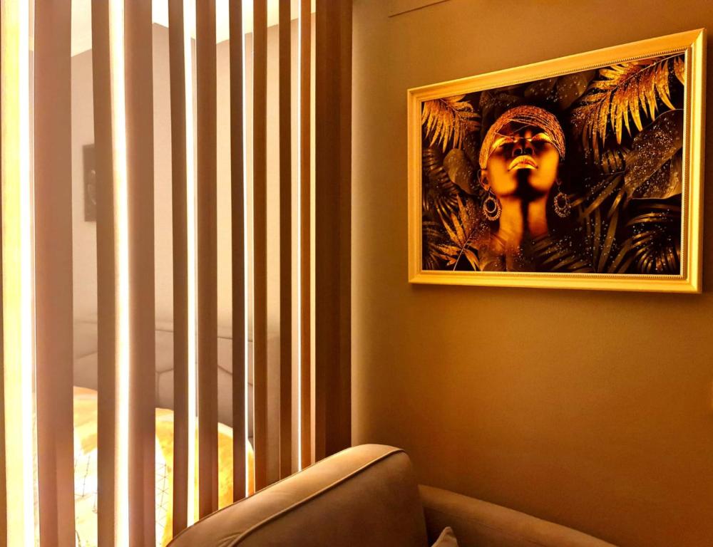 Living room corner lit by golden-hour light through the curtains