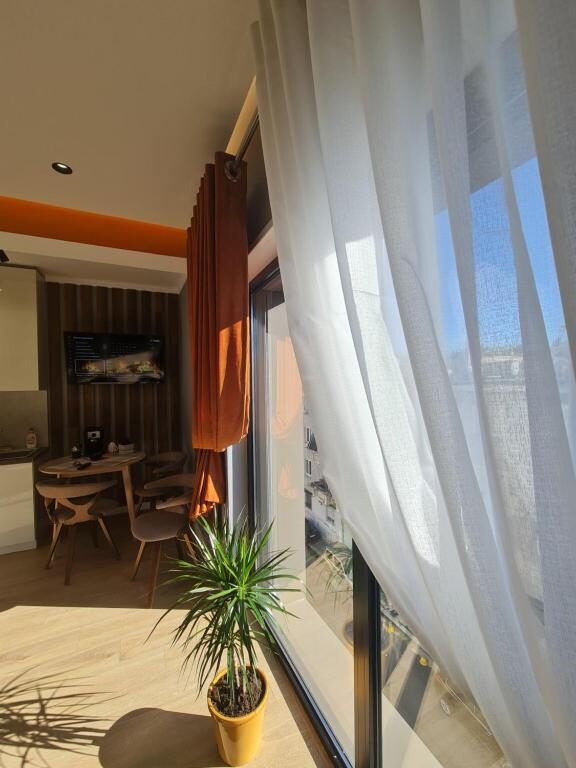 Cozy corner by the window with a potted plant
