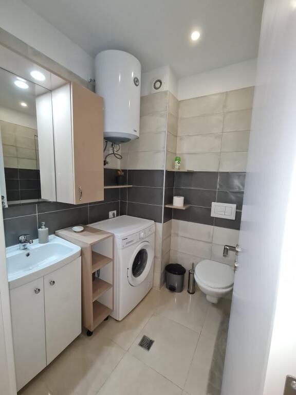 Water heater and washing machine in the bathroom