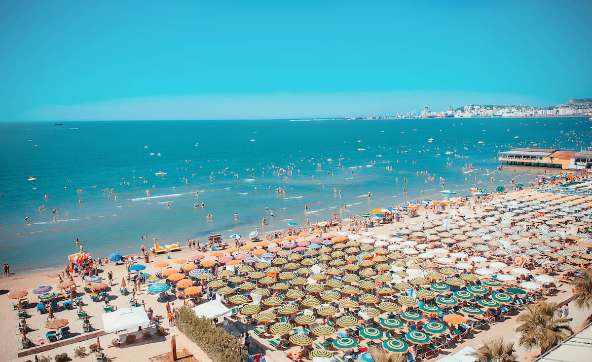 Durrës beach promenade with palm trees and beach umbrellas